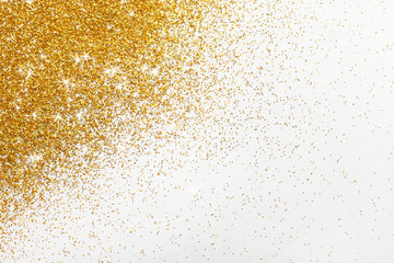 Bright beautiful shining golden glitter on white background, top view