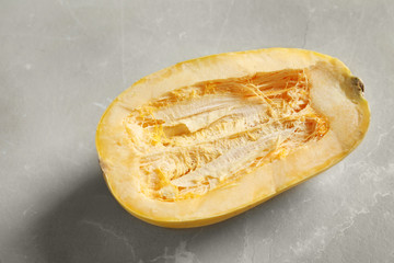 Raw cut spaghetti squash on gray table