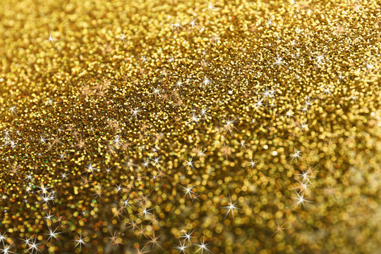 Bright beautiful shining golden glitter as background