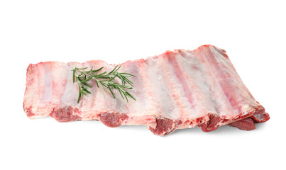 Raw ribs with rosemary on white background. Fresh meat