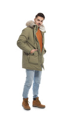 Fototapeta premium Young man wearing warm clothes on white background. Ready for winter vacation