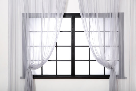Window frame with glass and curtains. Home interior