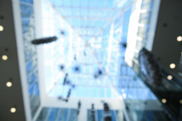 Bottom view of modern shopping mall interior. Bokeh effect