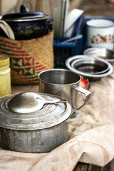 Group of rustic cookware, pots and pans on a table outdoors at the local market of Toliara, Madagascar.