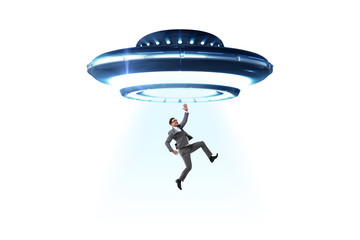 Flying saucer abducting young businessman 