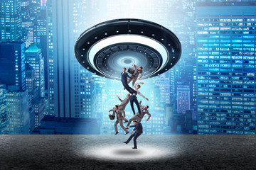 Flying saucer abducting young businessman 