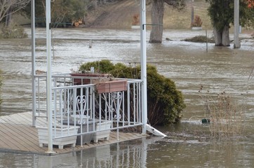 The Grand River floods to nearly porch-level in Woolwich, Ontario, Canada in 2014. 