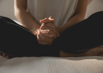 Woman with hand in praying position,Female prayer hands clasped together