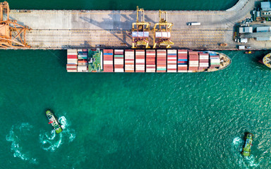 Aerial view of container ship in import - export business industry in Sriracha industrial port,...