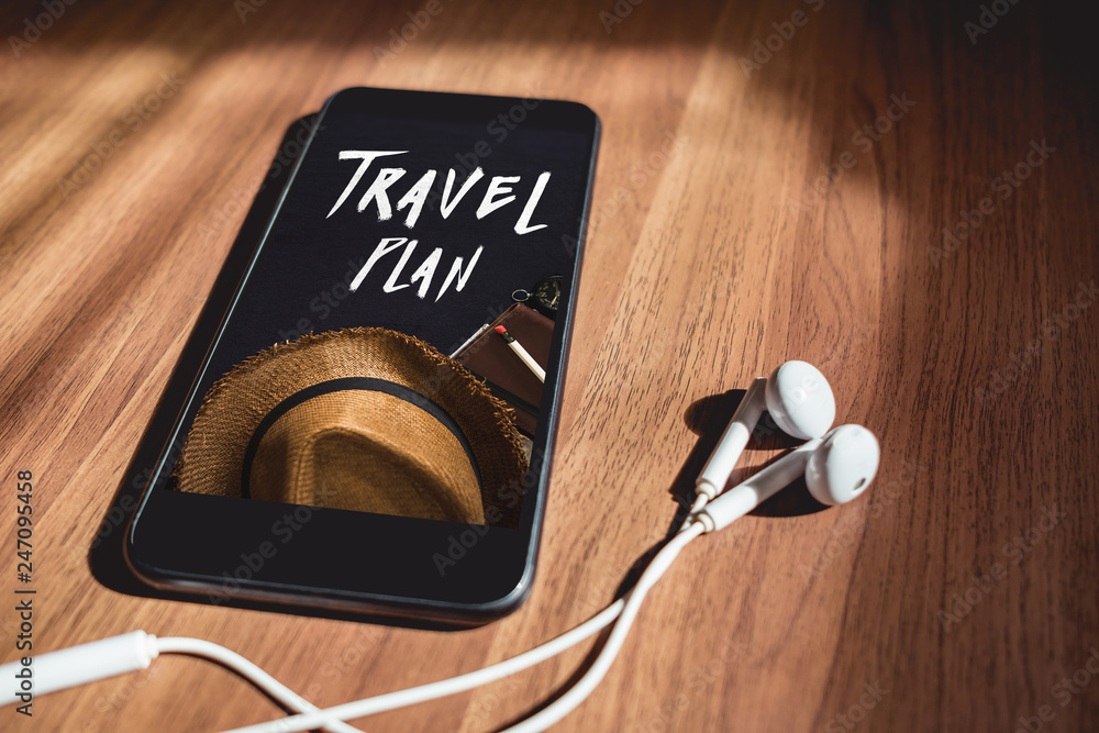 Poster blank mobile screen with earphones lay on brown table near window sunlight at afternoon,music lover 