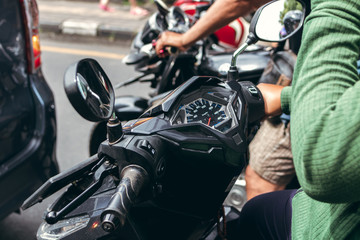Fototapeta na wymiar Scooter speedometer closeup. Bali island, Indonesia.