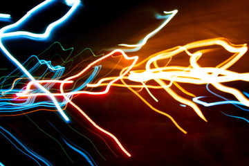 Abstract colorful light painting photography, movement of curves and waves abstract light on black...