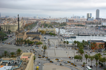 Aerial view over historical city center of Barcelona Spain with La Rambla main street, square...