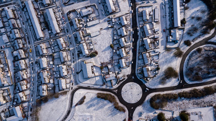 Top down aerial view of a Welsh town covered in fresh white snow (Ebbw Vale, Wales, UK)