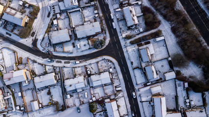 Top down aerial view of roads and houses covered in fresh snowfall (Ebbw Vale, Wales, UK)