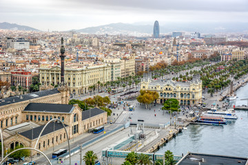 Aerial view over historical city center of Barcelona Spain with La Rambla main street, square...