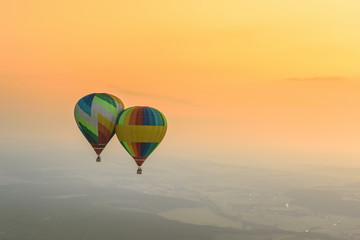 two balloons at sunset