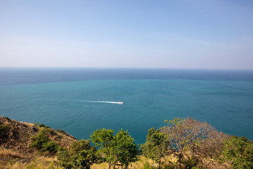 Speed boat/yacht in the sailing with island in the foreground. Summer vacation holidays in...