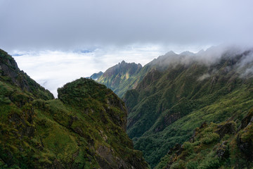 Fototapeta premium Mountain with clouds in Sapa town, southern Vietnam