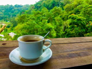 cup of coffee on wooden table