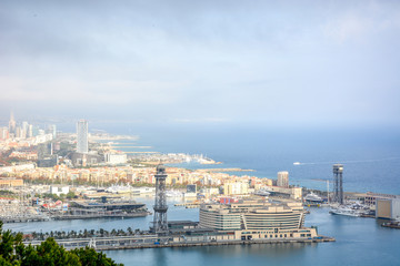 Aerial view over historical city center of Barcelona Spain with La Rambla main street, square...