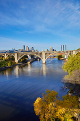 Fototapeta na wymiar Concrete white arch bridge over the Mississippi River in Minneapolis, Minnesota USA