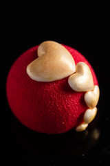 Cake with strawbery in the shape of heart on Valentine's Day