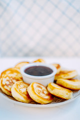 Sweet nutritious snack made of pancakes and jam