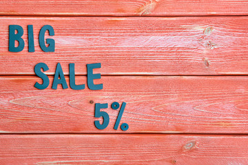big sale lettering and discount offer at five percent, metal letters on textured wooden boards color season 2019