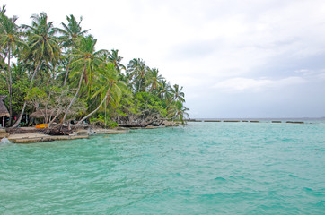 the island of Maldives of Fiholhohi a landscape the beach with azure water of the Indian Ocean in cloudy day