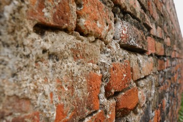 Old red brick wall texture pattern and background, selective focus.
