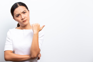 Angry woman standing isolated over white background