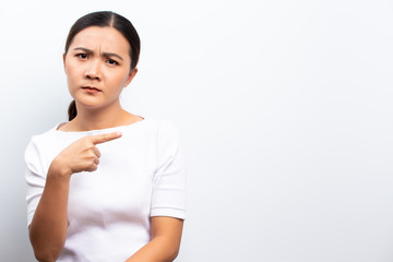 Angry woman standing isolated over white background