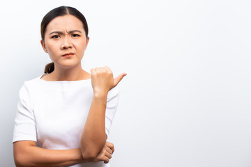 Angry woman standing isolated over white background