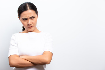 Angry woman standing isolated over white background
