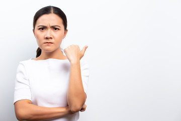 Angry woman standing isolated over white background