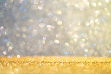 Abstract background filled with shiny gold and multicolour glitter