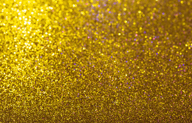 Abstract background filled with shiny gold glitter