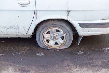car wheel flat tire on the road