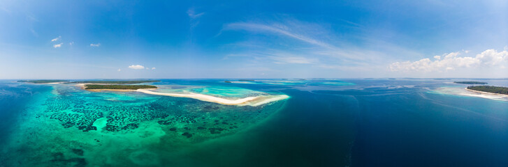 Aerial view tropical beach island reef caribbean sea. White sand bar Snake Island, Indonesia...