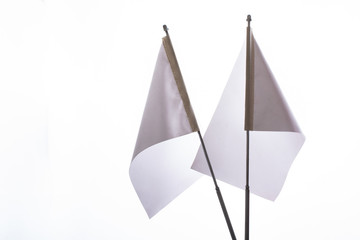 Two white flags on a white background in display