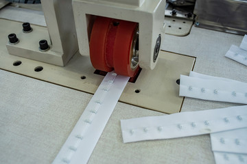 Automatic bra back button machine / underwear back machine / underwear production workshop