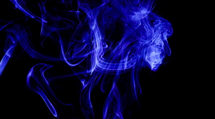 Blue smoke on black background