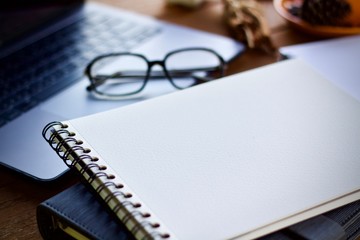 glasses and pen on a notebook