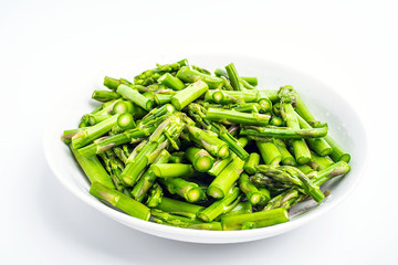 A dish of chopped asparagus