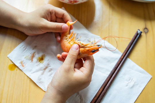 Food on the table / nutrition children's meal / baby peeling shrimp