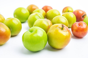 Fresh plums on white background