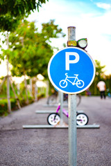 Bicycle sign, plate for bikes park in evening