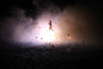 Fototapeta premium Hard chinese crackers in a row are exploding during New Years Eve in the Netherlands where this kind of fireworks are illegal