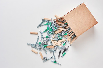 Open box with fall out tools for a furniture assembly, closeup